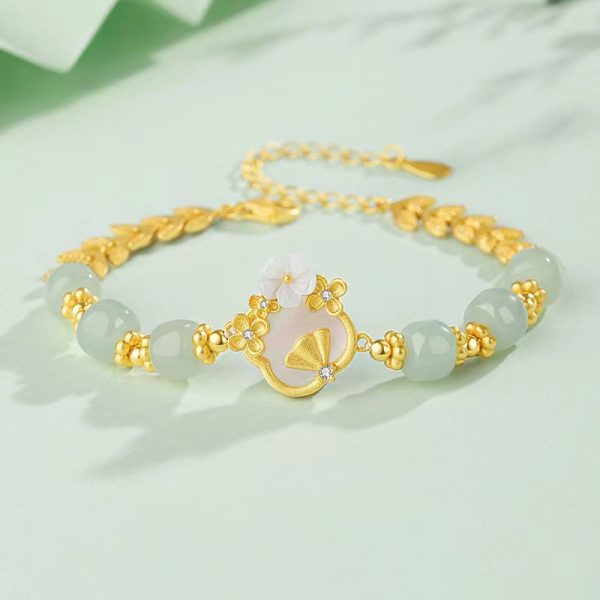 Luxurious White Jade Gold Bracelet with Elegant Flower Charm - Image 2
