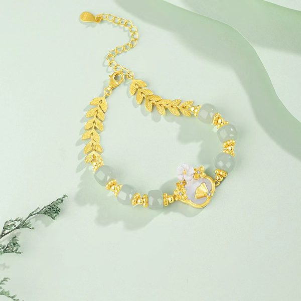 Luxurious White Jade Gold Bracelet with Elegant Flower Charm - Image 3