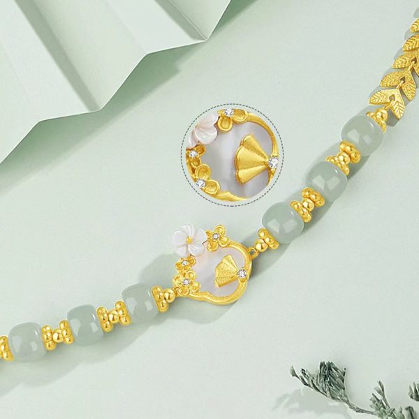 Luxurious White Jade Gold Bracelet with Elegant Flower Charm - Image 4